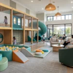 Indoor playground in an HOA community clubhouse with soft play equipment and parent seating