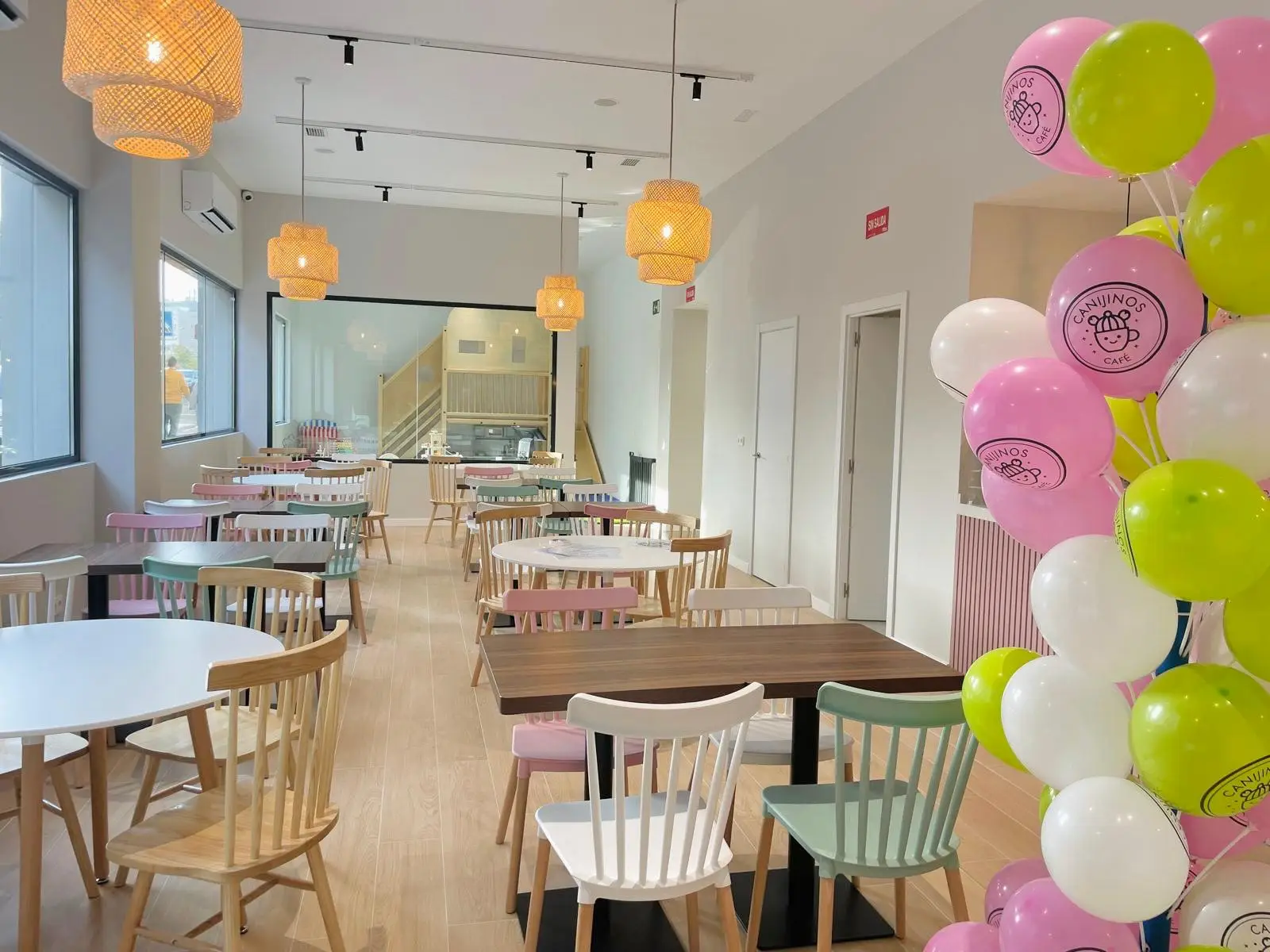 Canijinos Café official wide photo showing cafe seating and the visible play zone