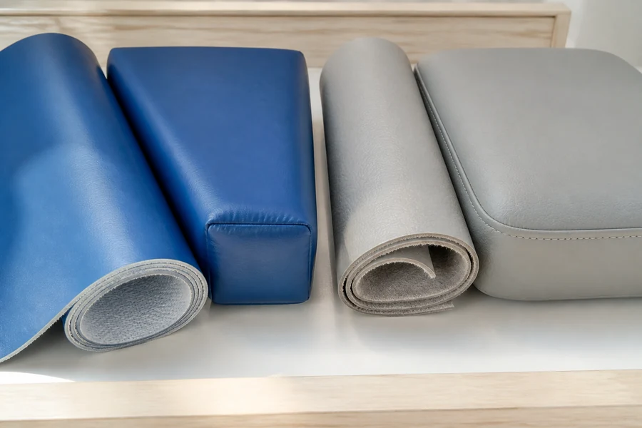 PVC vinyl and PU leather cover samples beside padded soft play and lounge components.